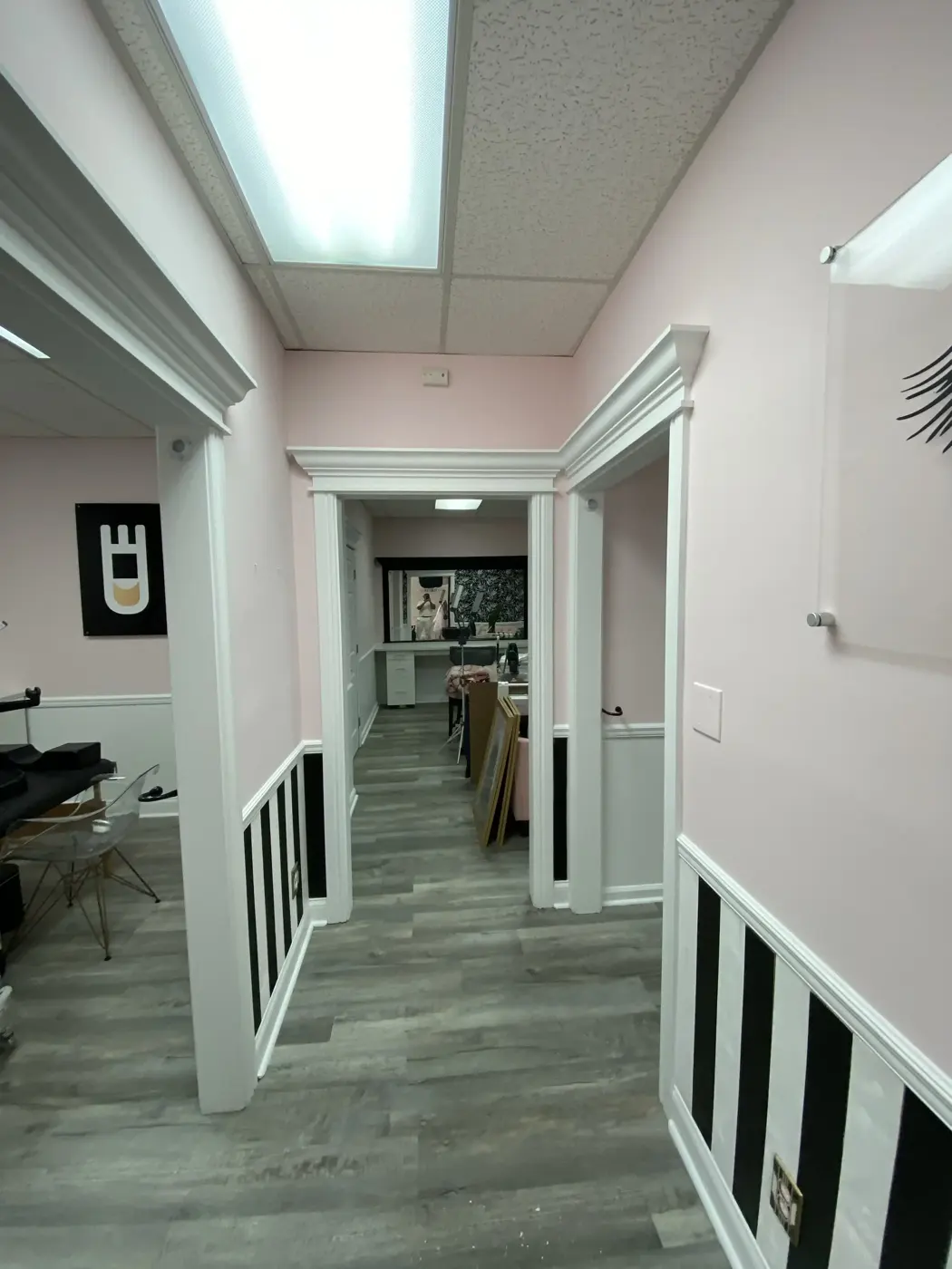 Freshly painted commercial interior hallway with black and white accent trim