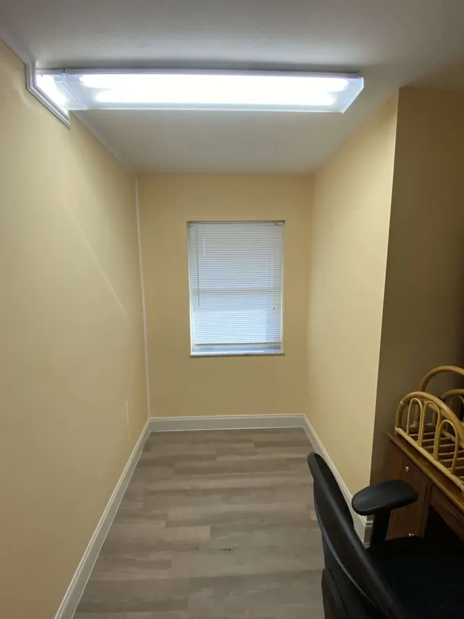 Freshly painted commercial office space with a large window