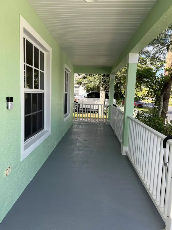 Close-up of a freshly painted porch and walkway
