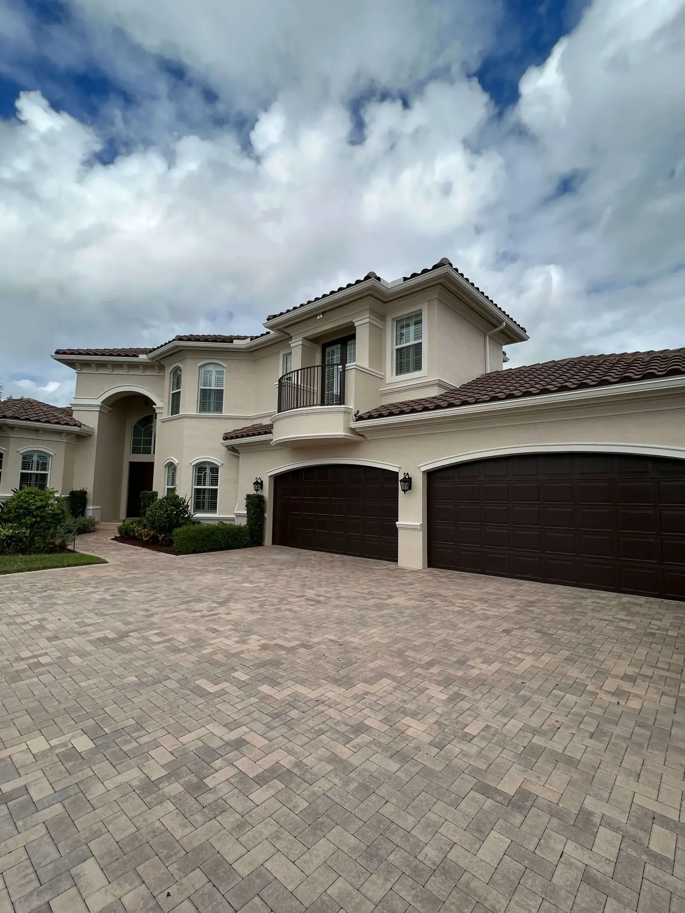 Two-story South Florida home with a freshly painted stucco exterior