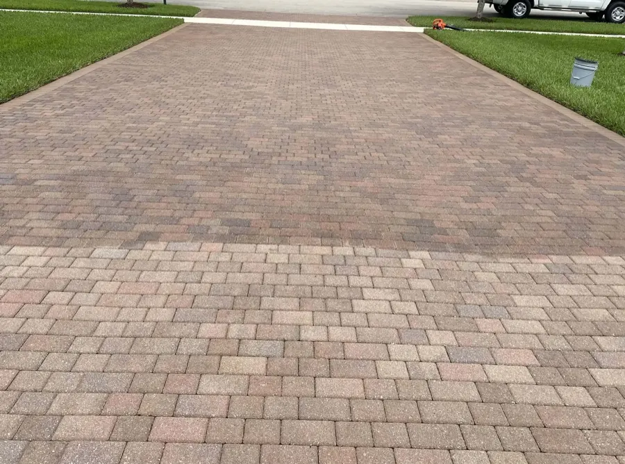 Wide paver driveway with a two-tone border pattern