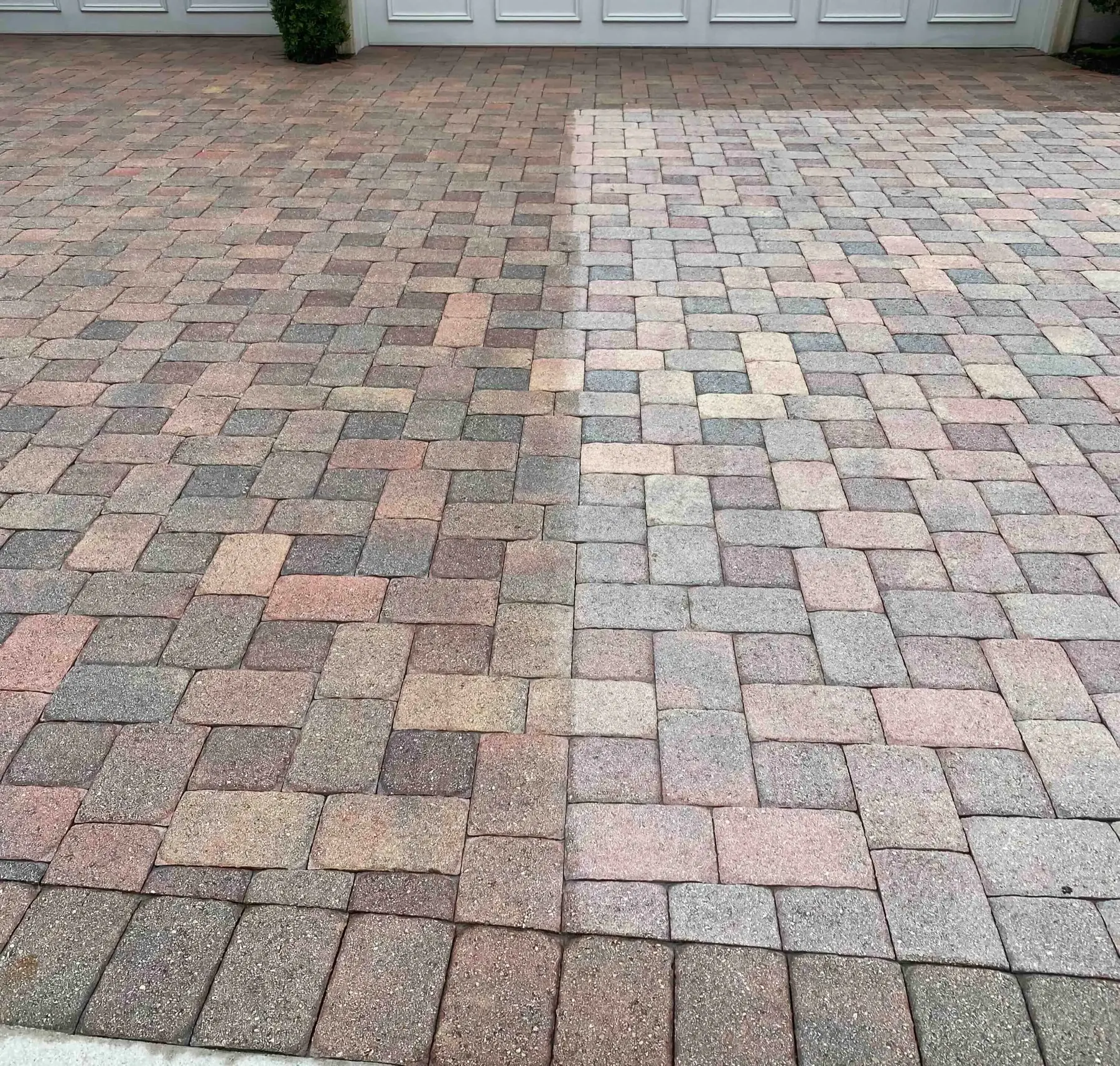 Paver driveway with a visible color variation across the surface